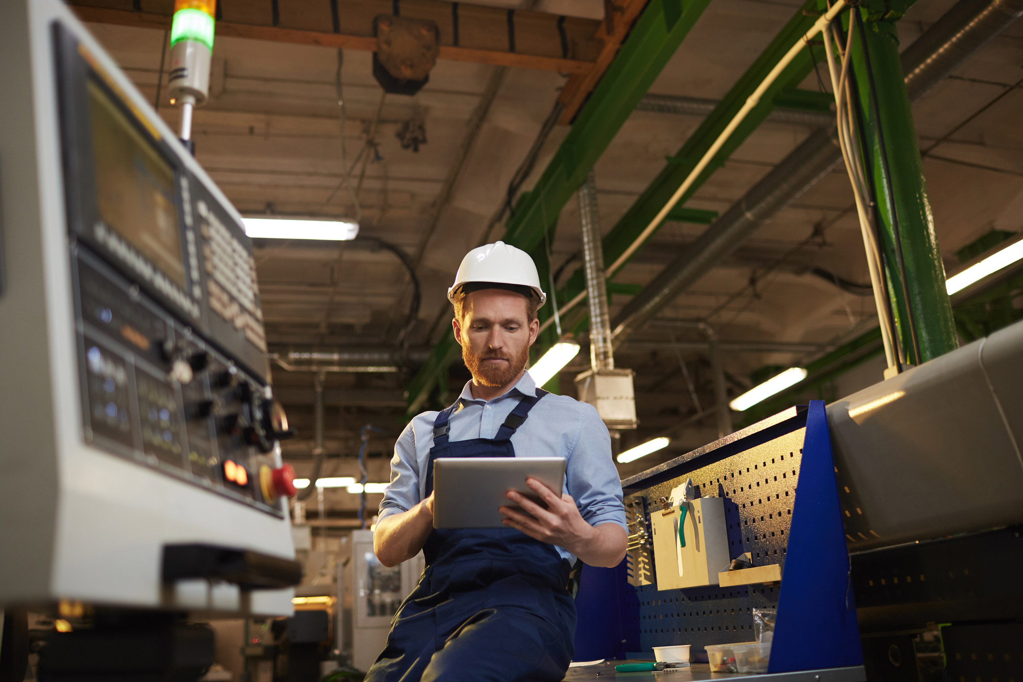 Engineer using AI on tablet